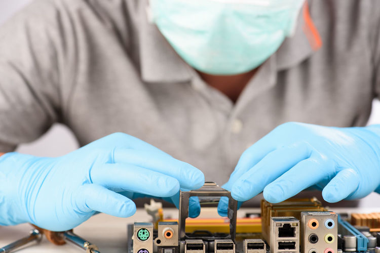 Close-up of engineer repairing circuit board