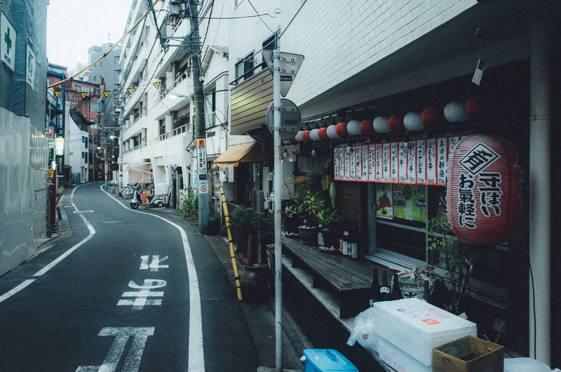 Road amidst buildings in city
