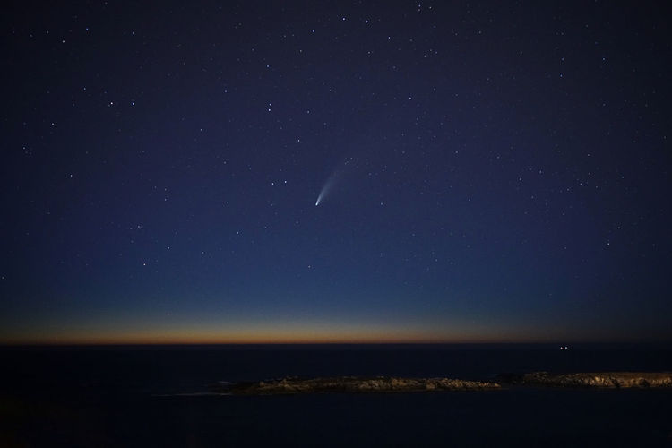 Comet neowise over the night sky of the galician coast