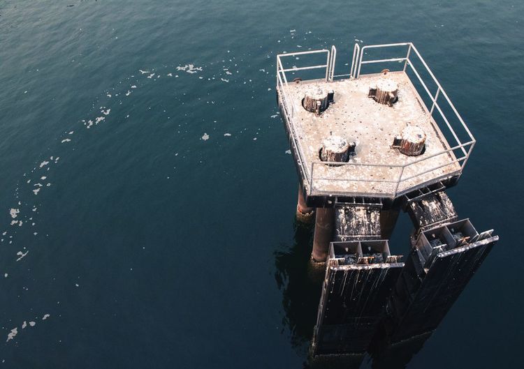 High angle view of abandoned pier over sea