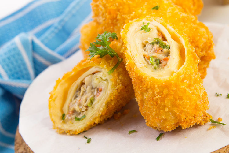 Close-up of fried spring rolls with noodles stuffing