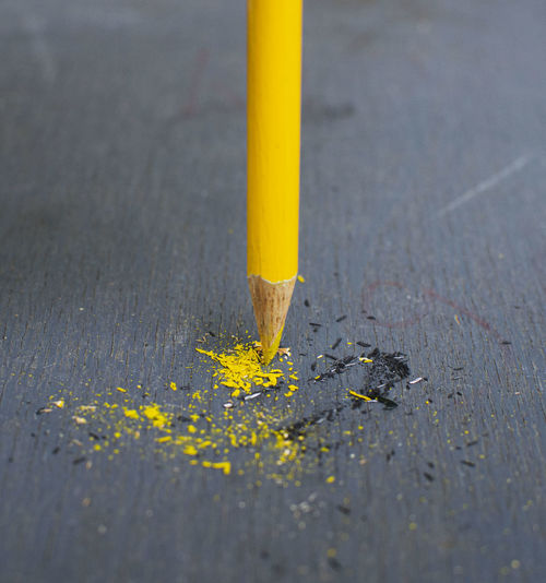 High angle view of yellow pencils on road