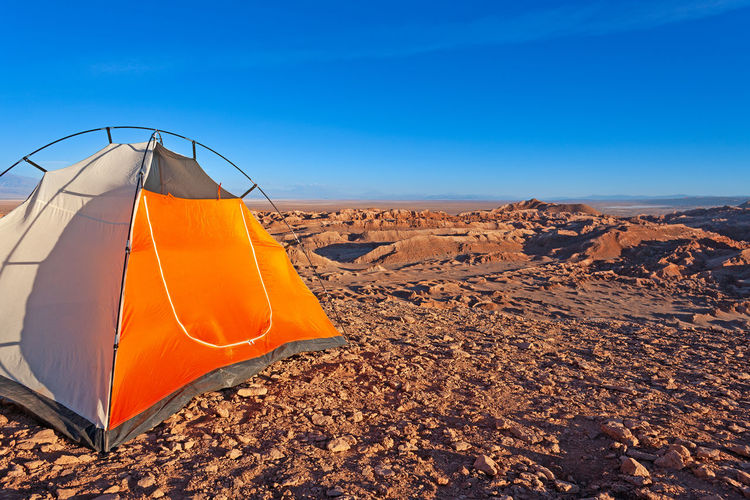Low angle view of tent against clear blue sky