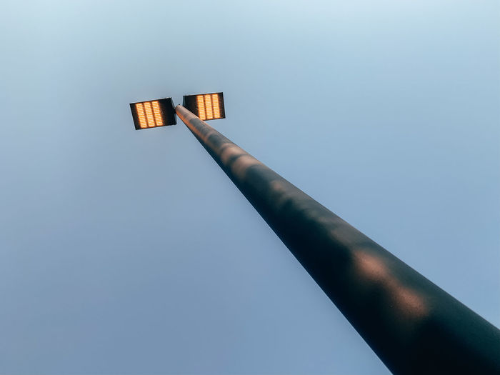Low angle view of pole against clear sky
