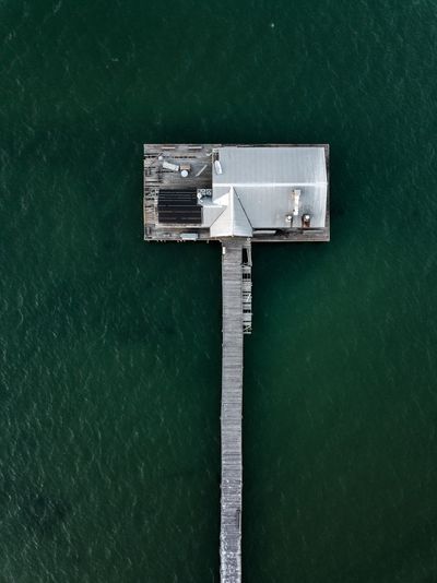 High angle view of metallic structure against sea