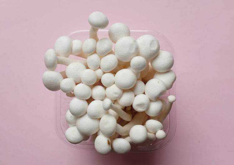 High angle view of pills against white background