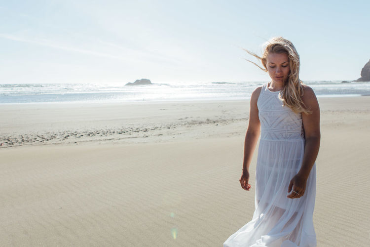 Young woman standing on beach