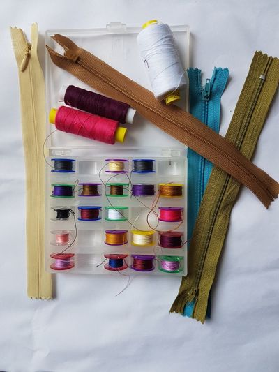 High angle view of colorful sewing items on table