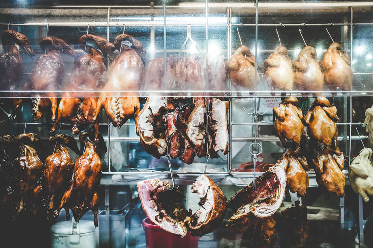 Chicken meat hanging in butcher shop
