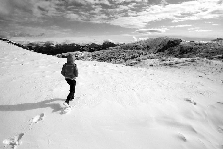 First snow on dolomites, walking on altopiano della rosetta