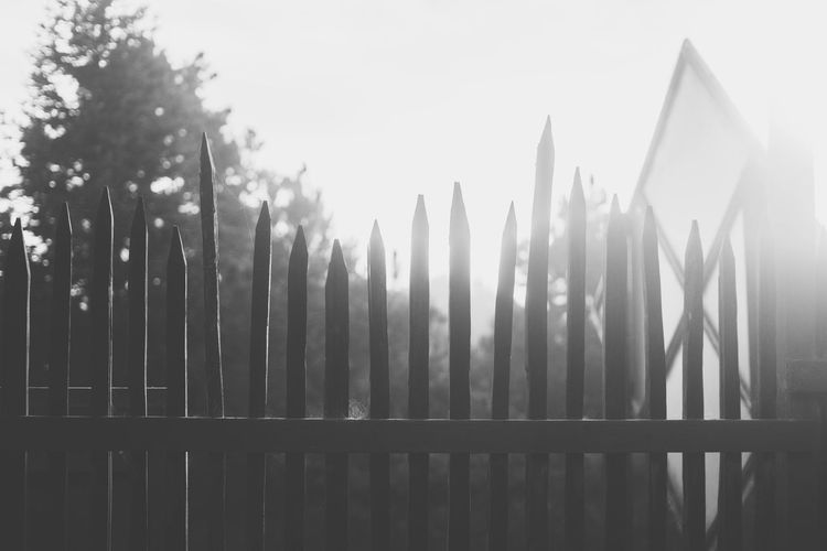 View of wooden fence against sky