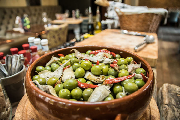 Close-up of olives in bowl on table