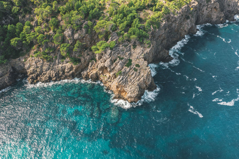 Aerial: tropical coastline with rich colours and turquise water in spain