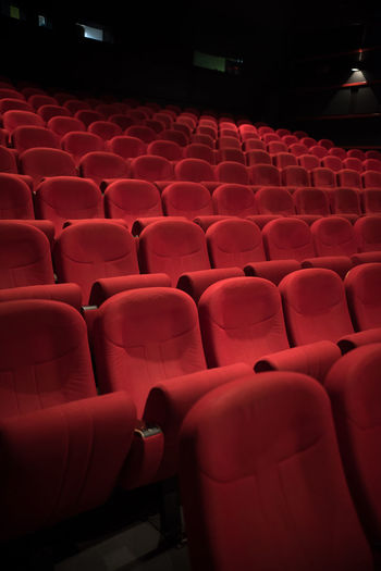 Close-up of empty chairs in auditorium
