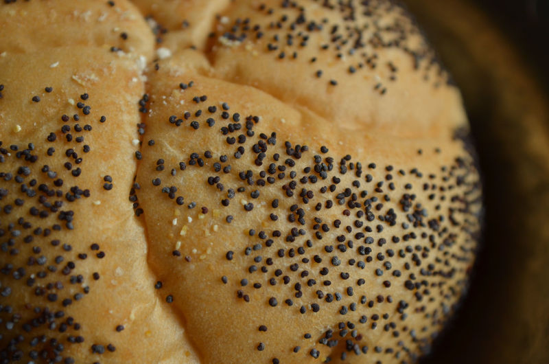 Close-up of poppy seeds on bun