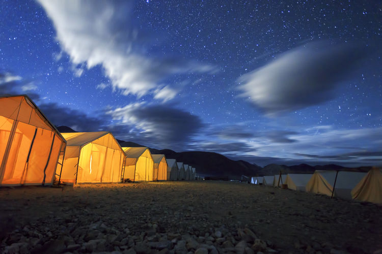 Scenic view of beach against sky at night