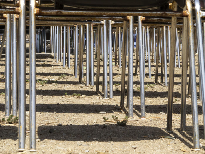 Row of metal fence on sunny day