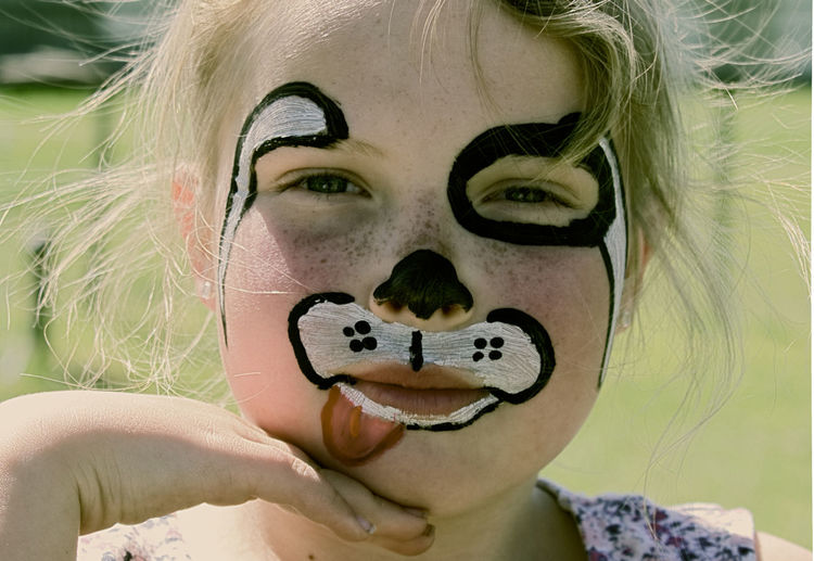 Close-up portrait of girl with face painting