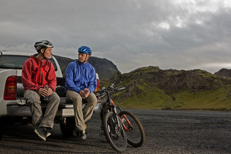 Two friends riding their mountain bikes around lake thingvellir
