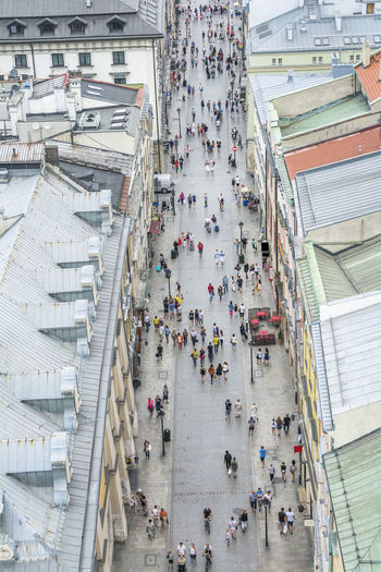 High angle view of people walking on street in city