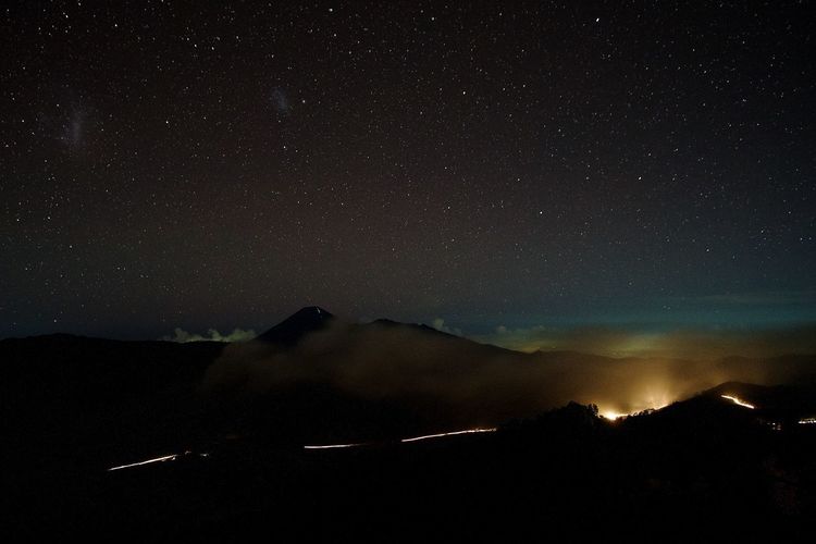 Aurora borealis against star field at night
