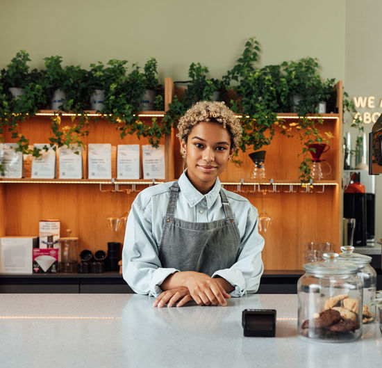 Portrait of young businesswoman working at home
