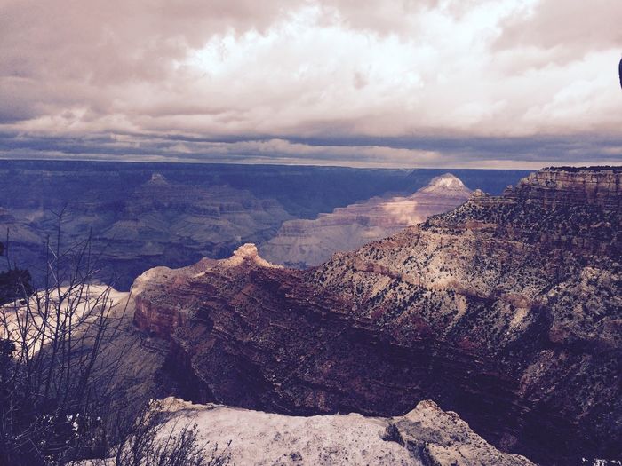 Pipe creek vista at grand canyon national park against cloudy sky