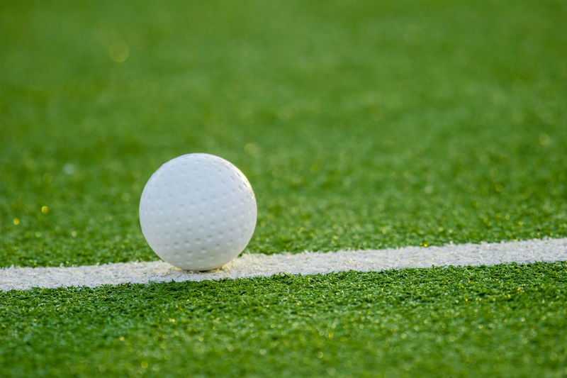 Close-up of golf ball on field