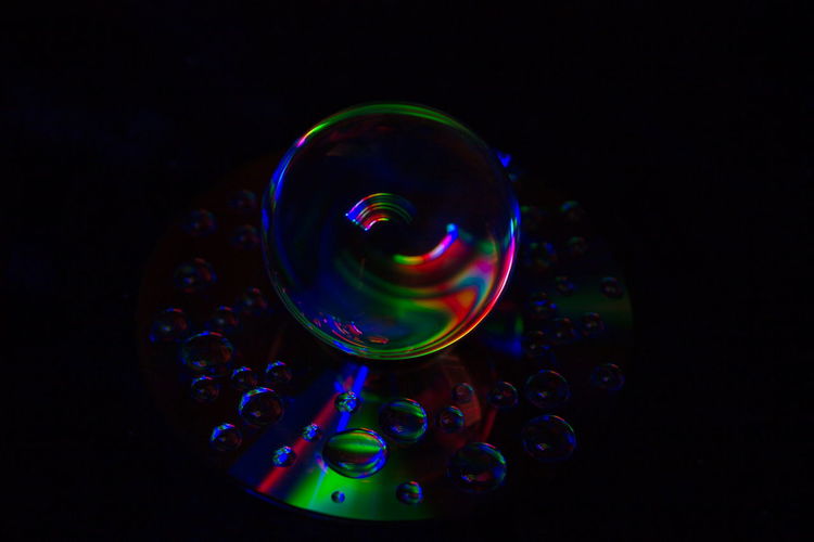 Close-up of multi colored lights against black background