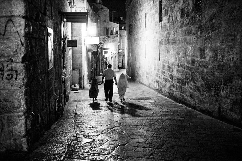 Full length of woman walking in alley