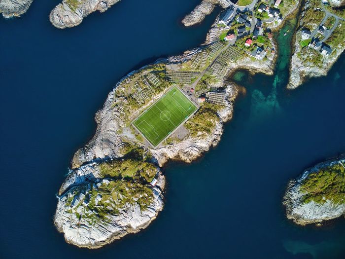 High angle view of sea by buildings in city