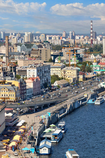Fragment of the old district of kyiv, podil, in the area of the river station, with berths, boats. 