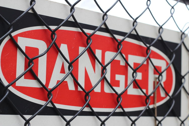 Close-up of danger signboard