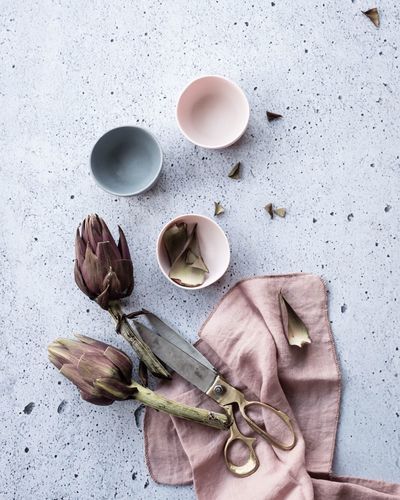 High angle view of coffee and cups on table