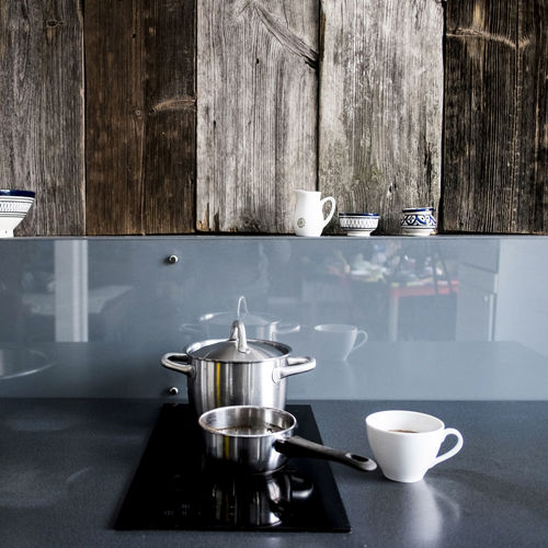Kitchen utensils at home against wooden wall kitchen utensils