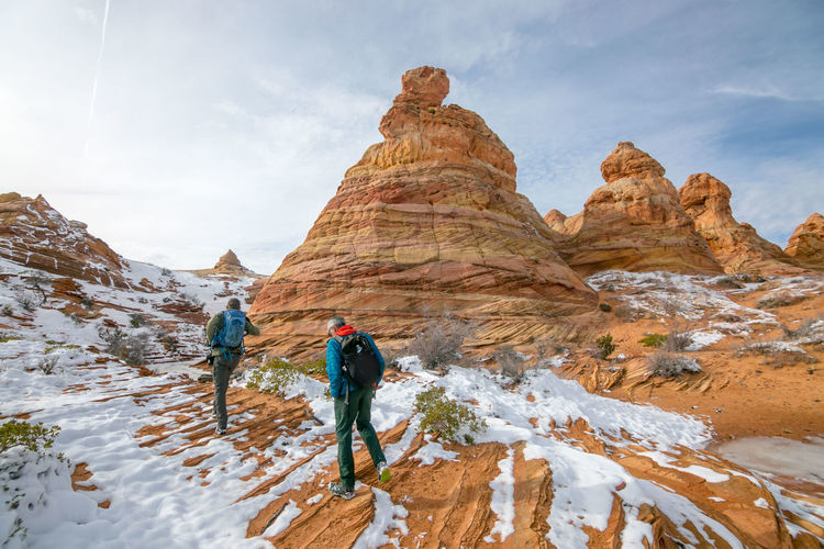 Hikers headed towards snowy cottonwood cove in the south coyote buttes