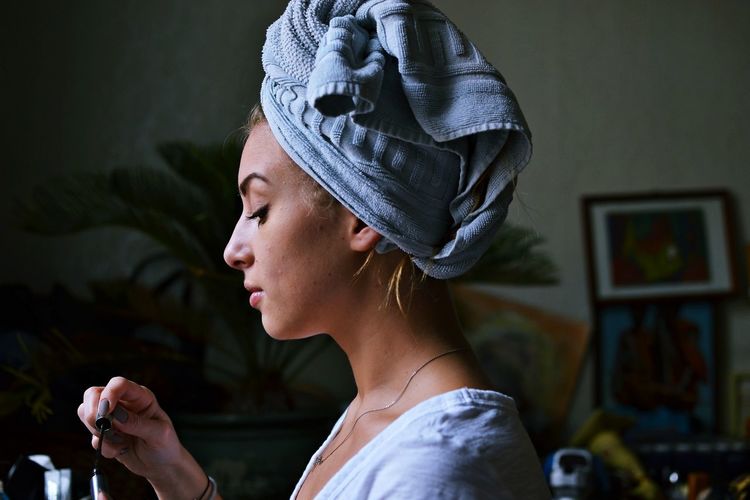 Woman with towel wrapped around her head