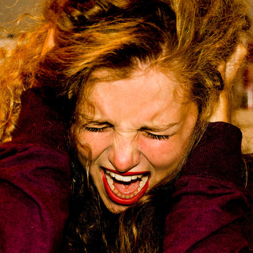 Close-up of young woman scream