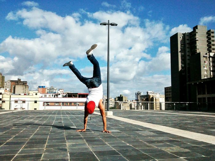 Young man doing handstand