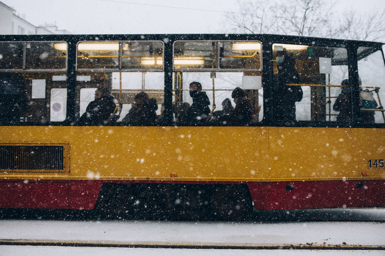 View of passengers in bus during snowfall