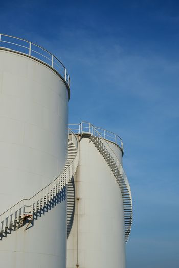 Low angle view of factory against sky