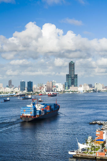 The container ship sailing into the port of kaohsiung, taiwan.