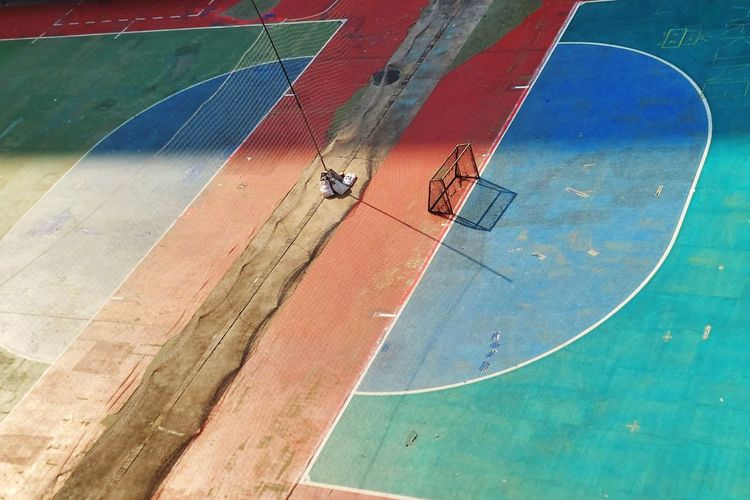 High angle view of people walking on court