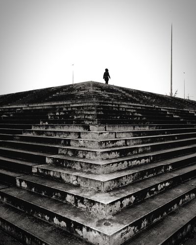 Silhouette of person on steps