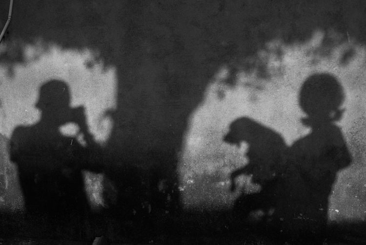Silhouette people standing against blurred background