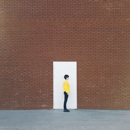 Full length of woman standing at entrance