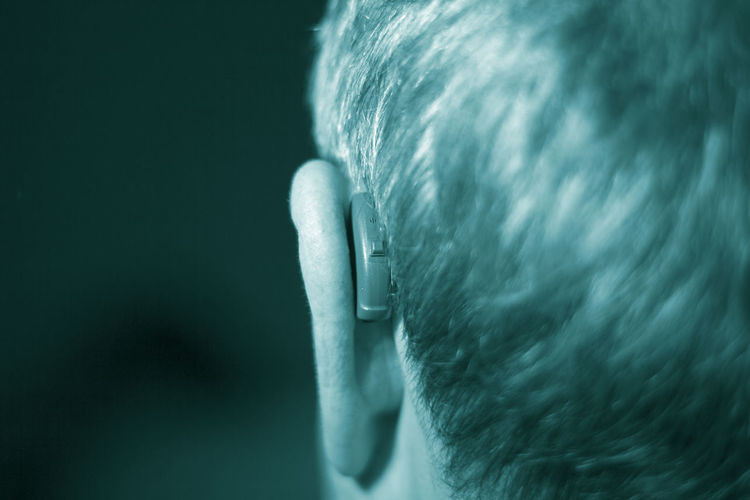 Close-up of man with hearing aid