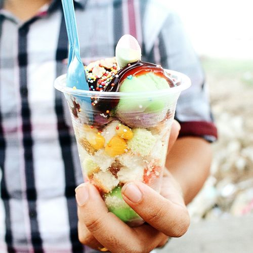 Male hand holding frozen dessert