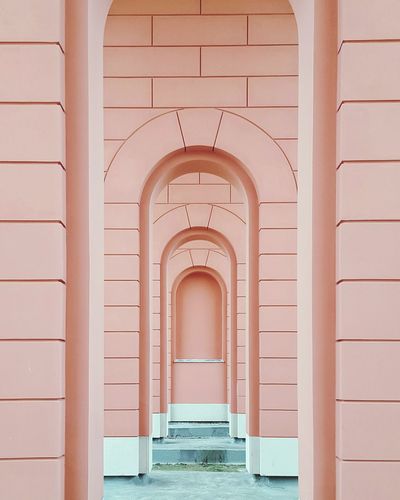 Exterior of pink brick building