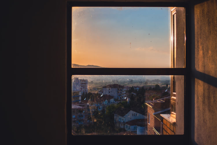 Cityscape seen through glass window